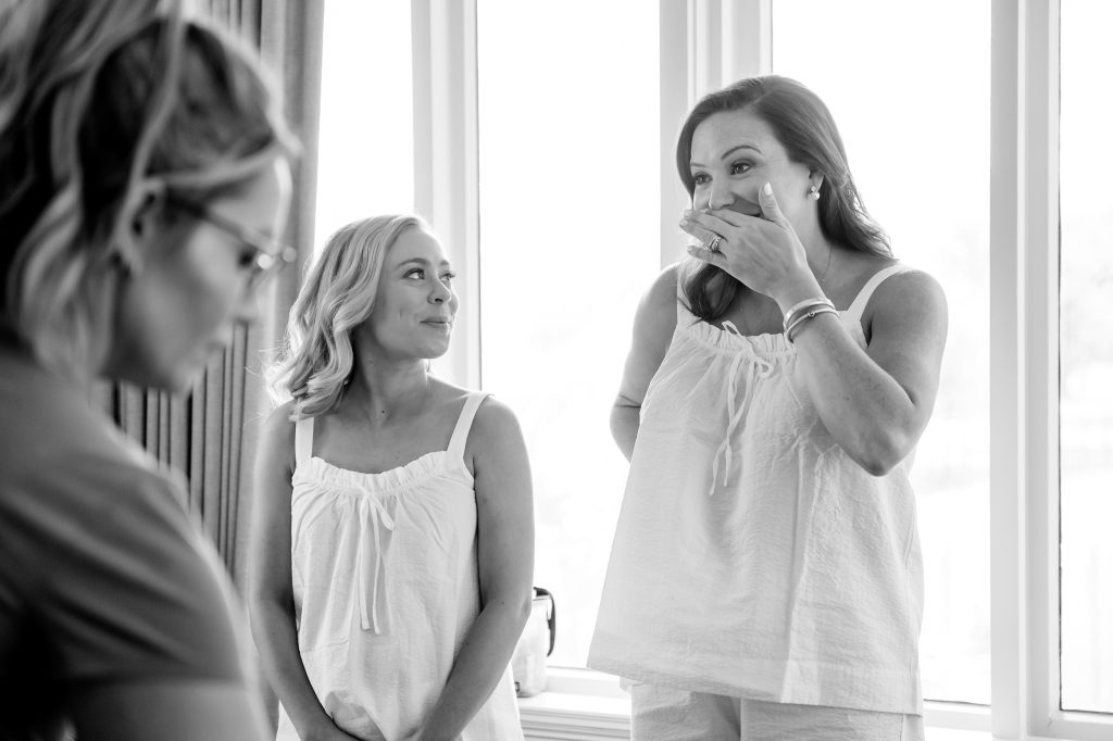 Bride sharing a candid getting-ready moment with family before her Houston wedding