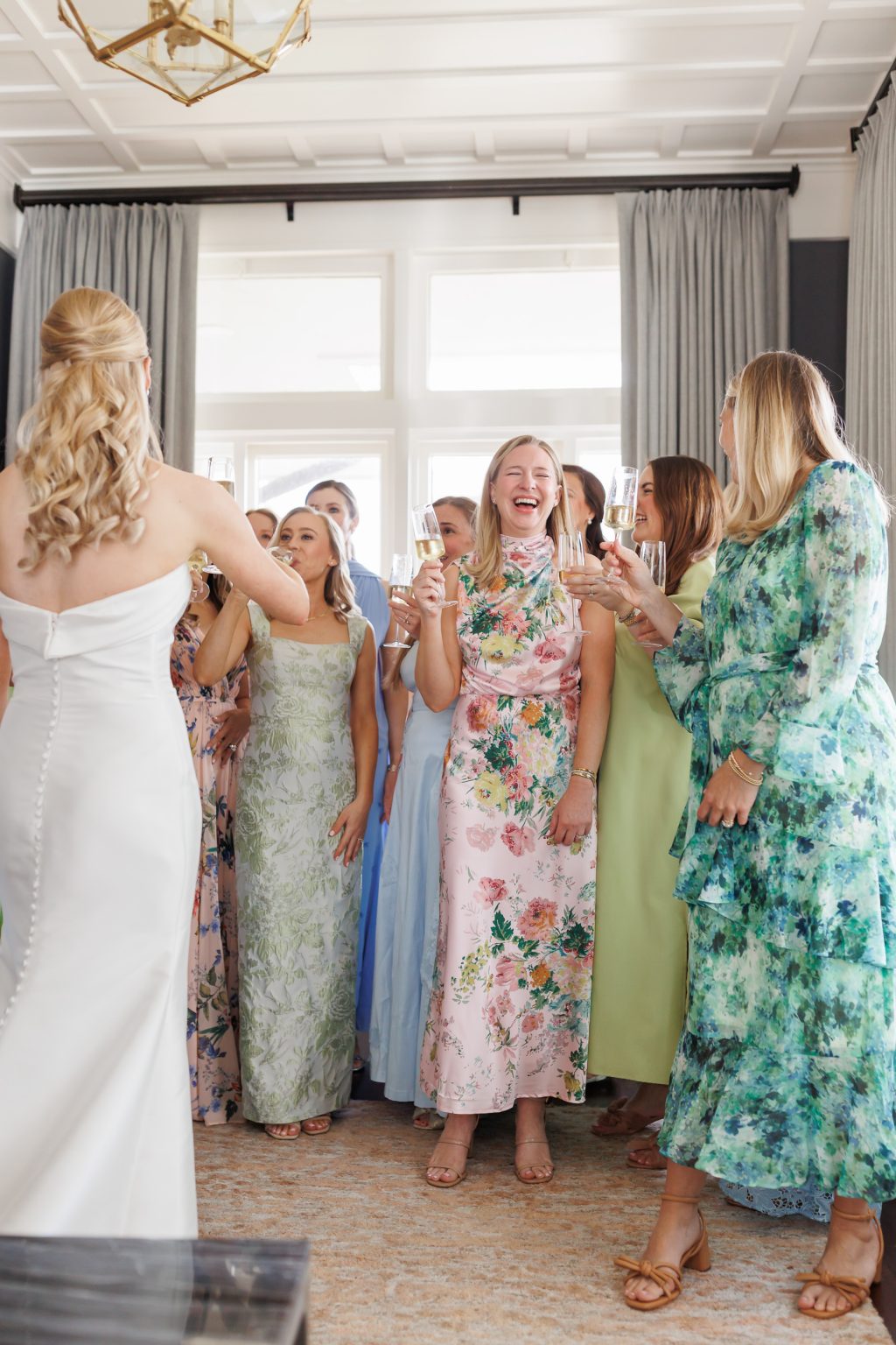 Bride celebrating with bridesmaids before the ceremony at La Colombe d’Or
