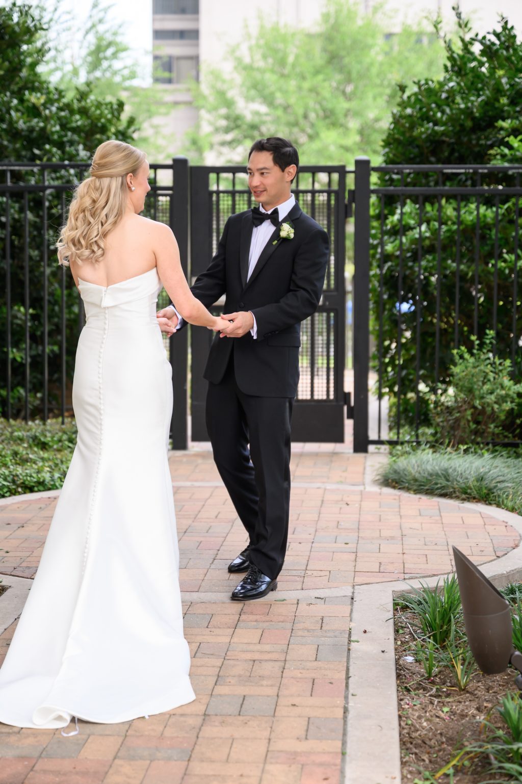 Bride and groom seeing each other for the first time in the La Colombe d’Or courtyard