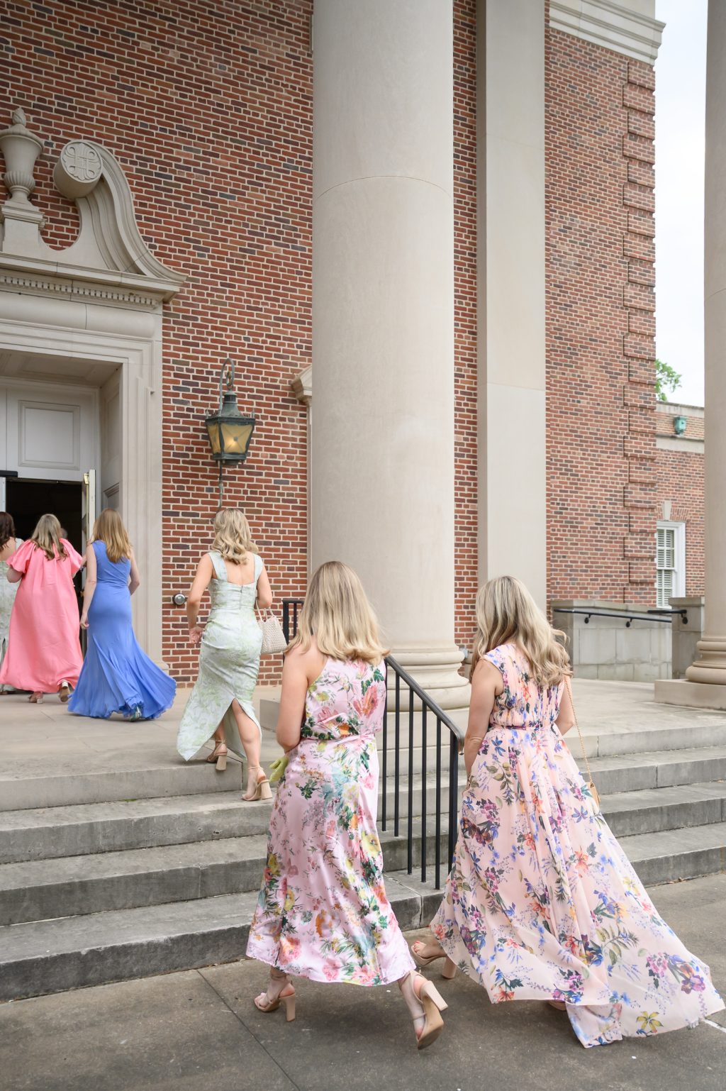 Wedding guests walking up the steps of St. Luke’s Methodist Church in Houston