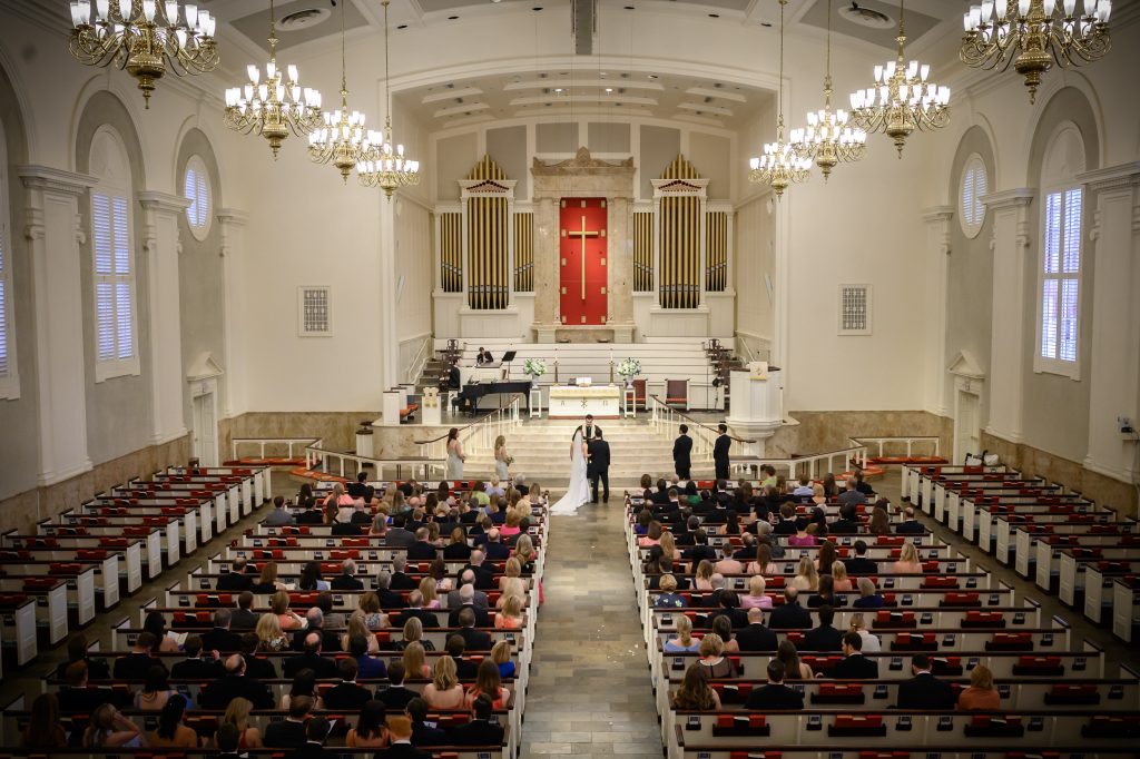 Interior view of the church filled with guests during Taylor and Michael’s Houston wedding