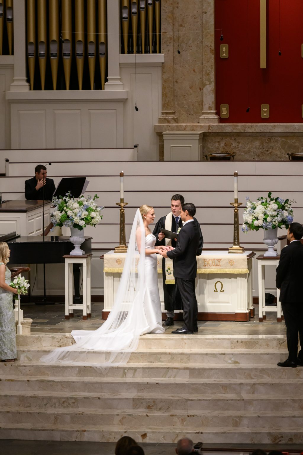 Bride and groom exchanging vows at St. Luke’s Methodist Church in Houston