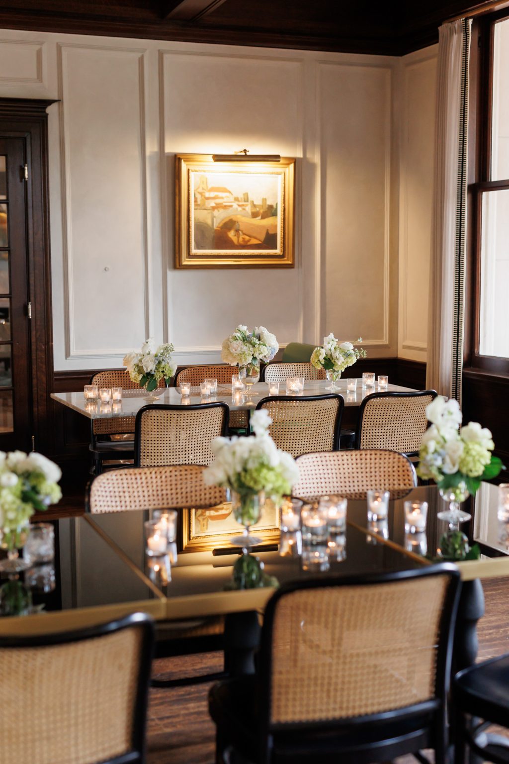 Intimate dining room set for a wedding reception inside La Colombe d’Or in Houston