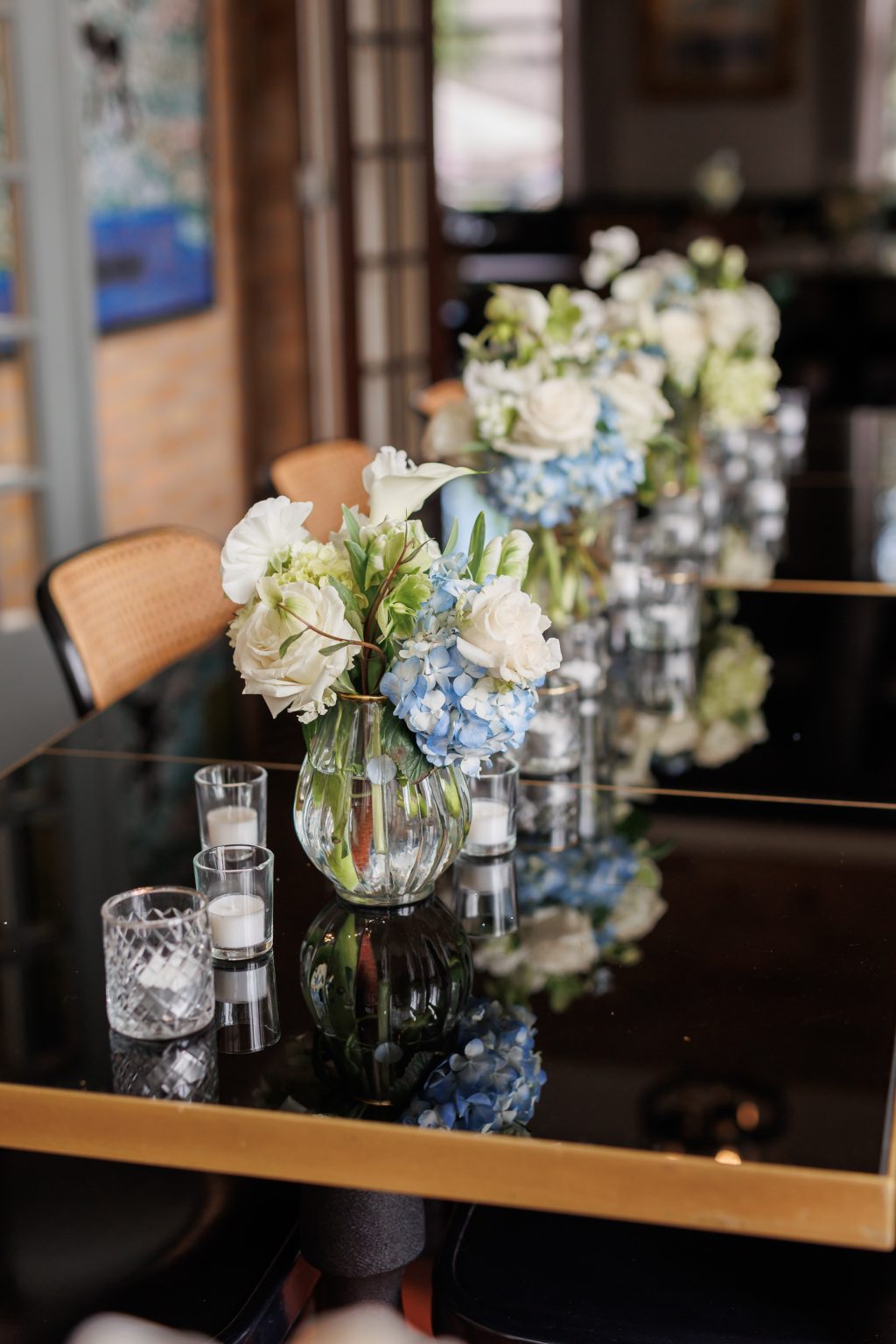 White and green floral arrangements by Botanical No. 9 inside La Colombe d’Or in Houston