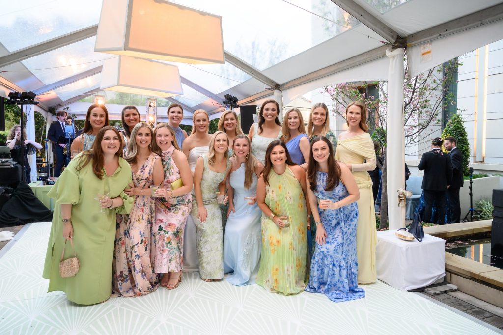 Bride celebrating with friends during cocktail hour at La Colombe d’Or
