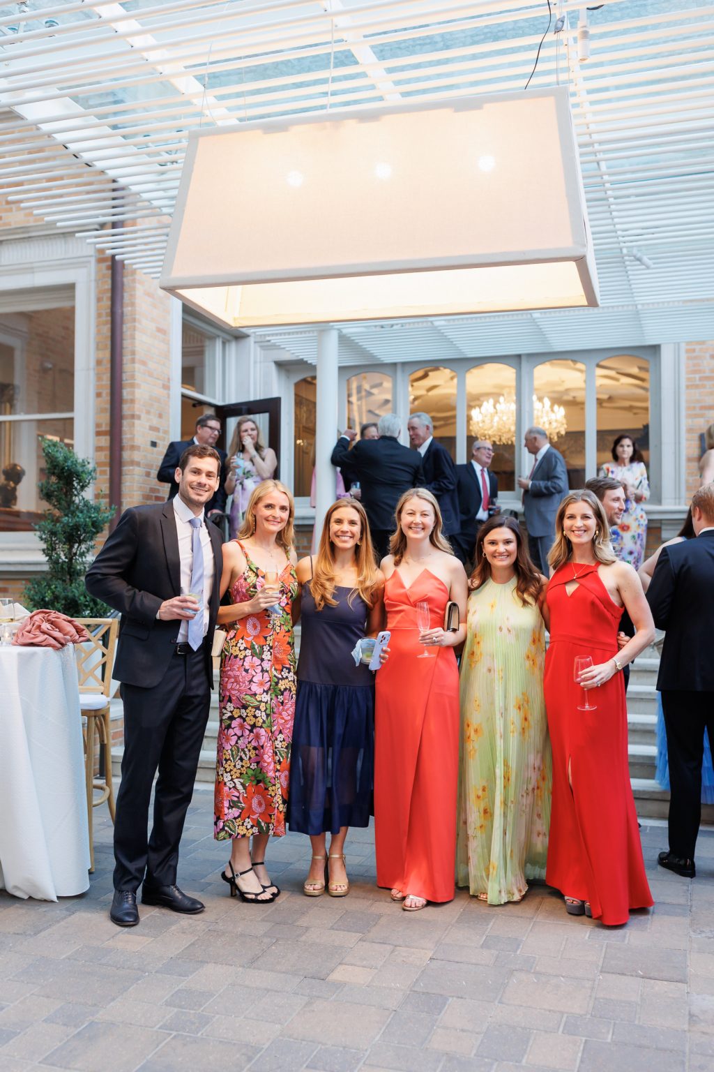 Wedding guests gathered beneath the tented reception space at La Colombe d’Or