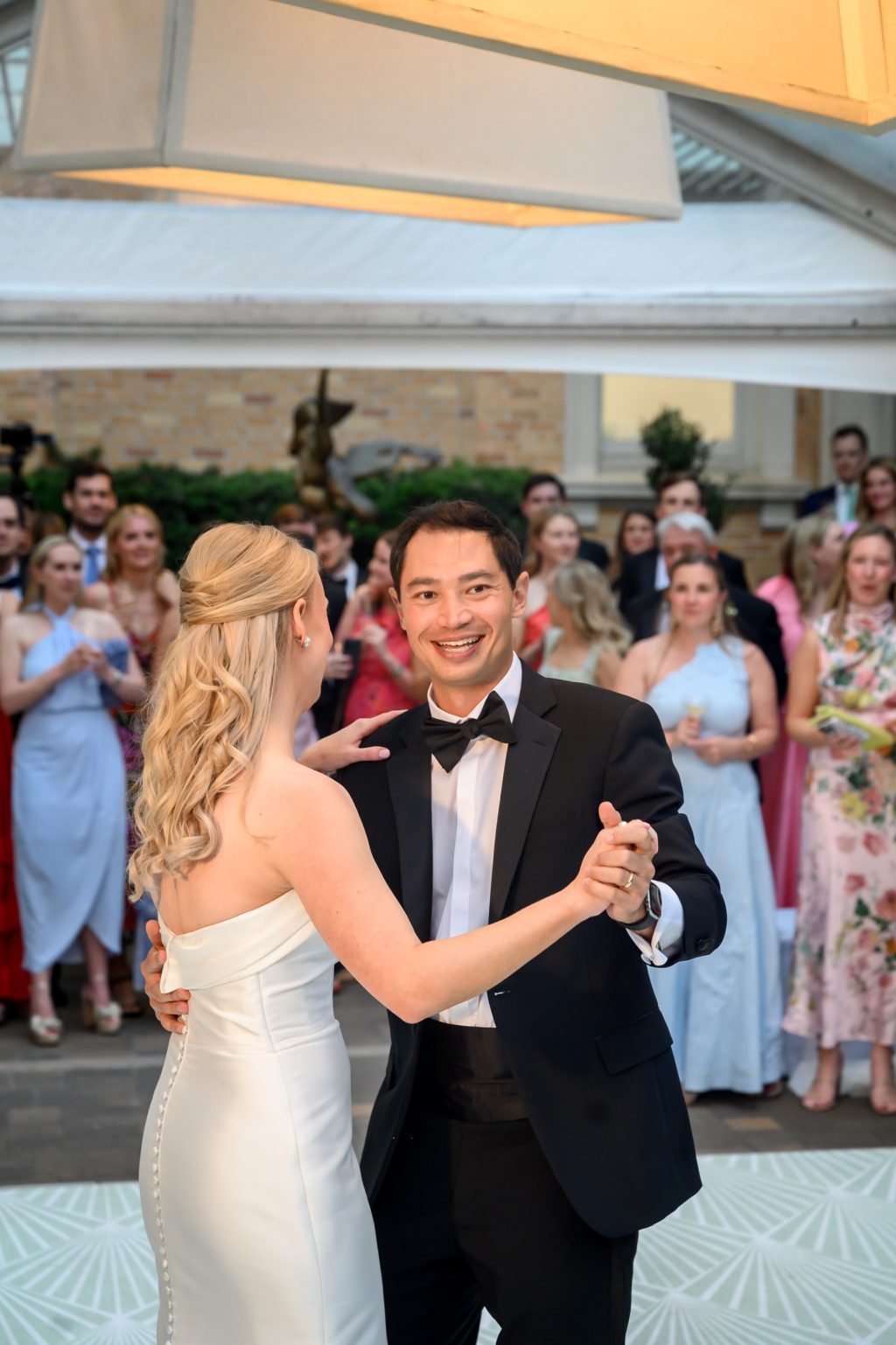 Bride and groom smiling during their first dance at La Colombe d’Or