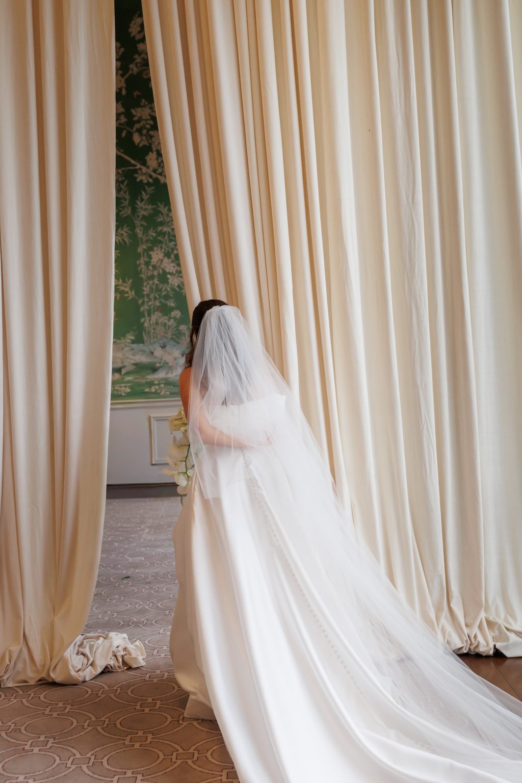 Bride photographed beside the historic green wallpaper at River Oaks Country Club