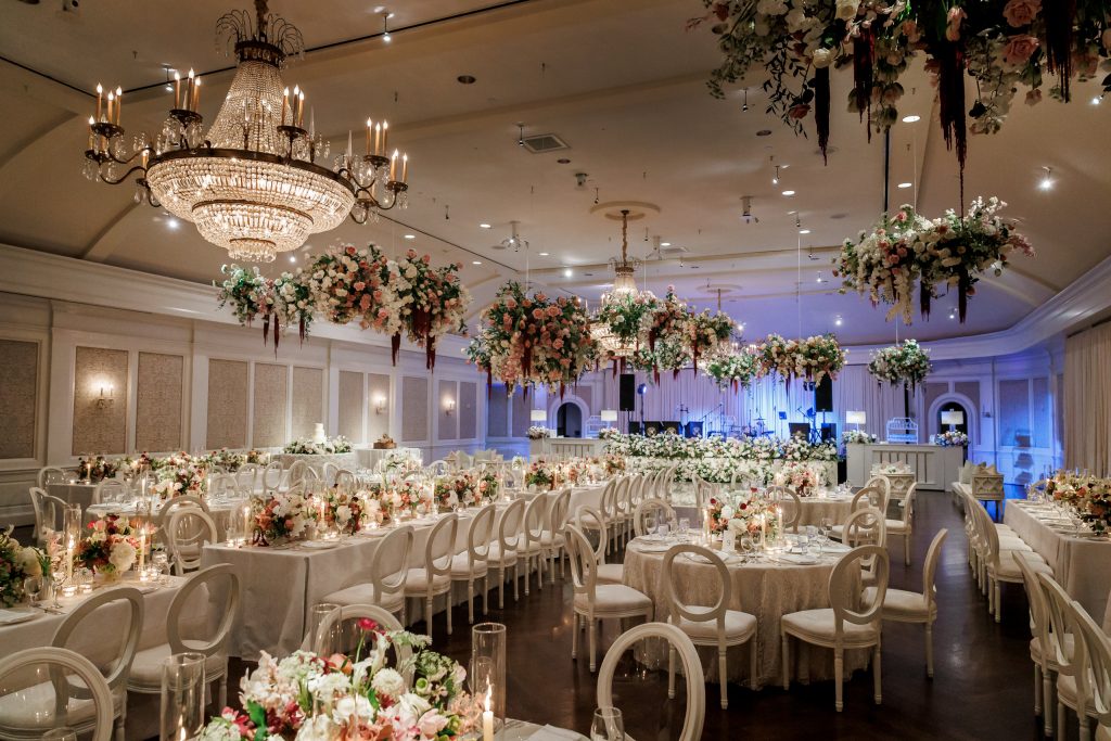 Grand Ballroom at River Oaks Country Club filled with floral installations and reception tables