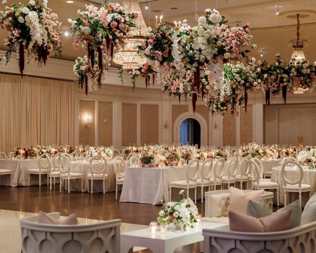 Floral-filled wedding reception in the Grand Ballroom at River Oaks Country Club